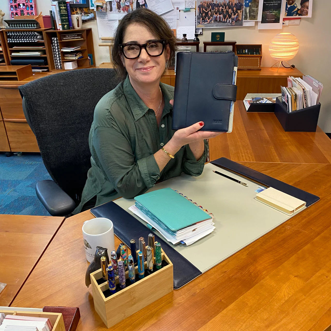 A compact lunch‑hour writing kit on a small café table: junior discbound notebook, 3x5 cards on a writing platform, pen folio, and a slim tri‑folio.