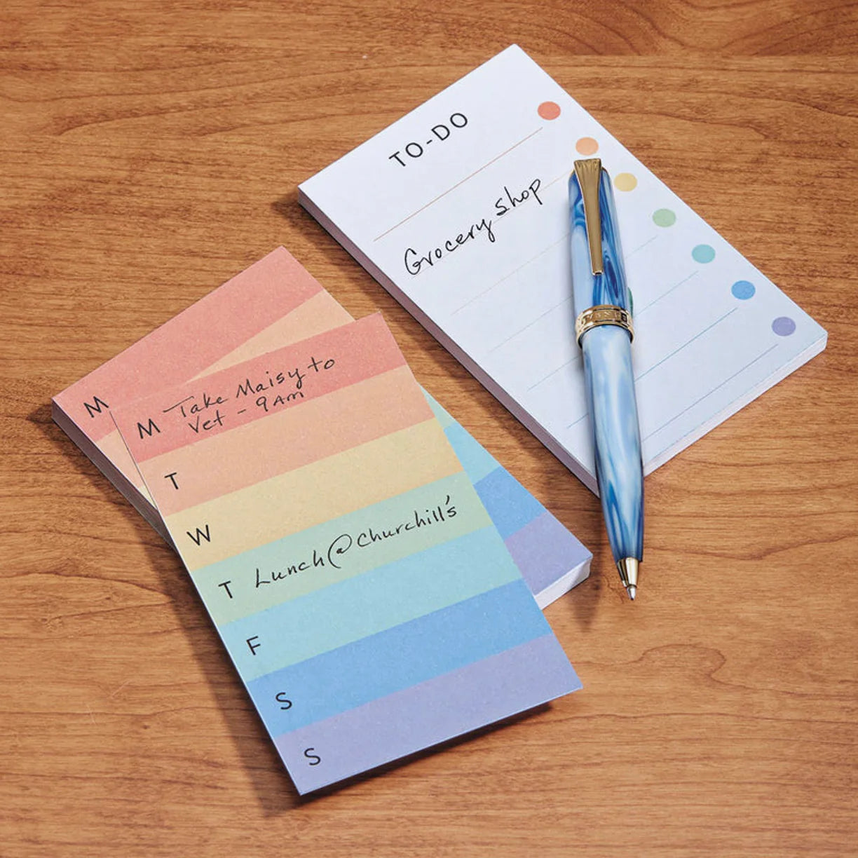 A compact bamboo card stand displaying four 3x5 cards—today, tomorrow, waiting, and notes—with a pen on the front ledge and a neat stack of spare cards behind.