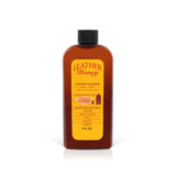 Leather Honey leather cleaner bottle, amber plastic jug with a black screw cap and a bright yellow label.