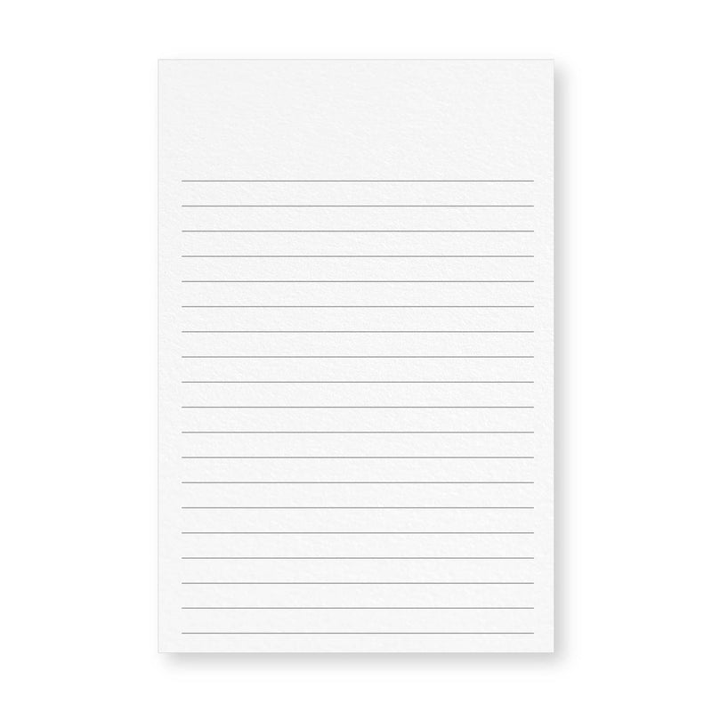 Close up of a white vertical 4x6 lined card showing evenly spaced horizontal lines.